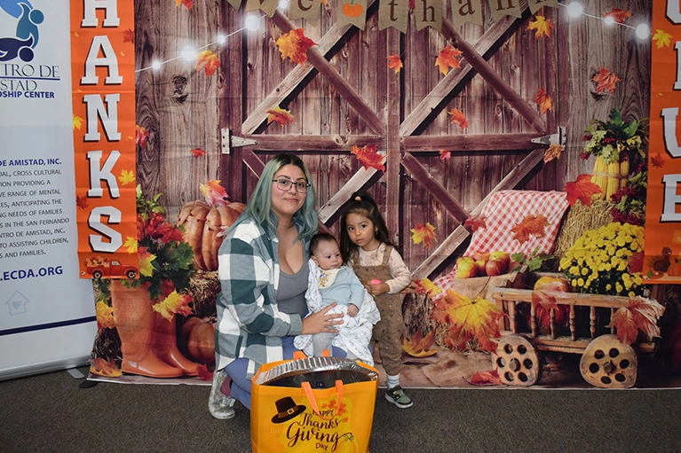 Mother and toddler at the El Centro de Amistad Thanksgiving event